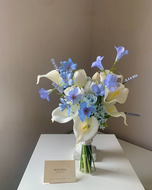 Airy blue and white flowers in the Abigail bouquet