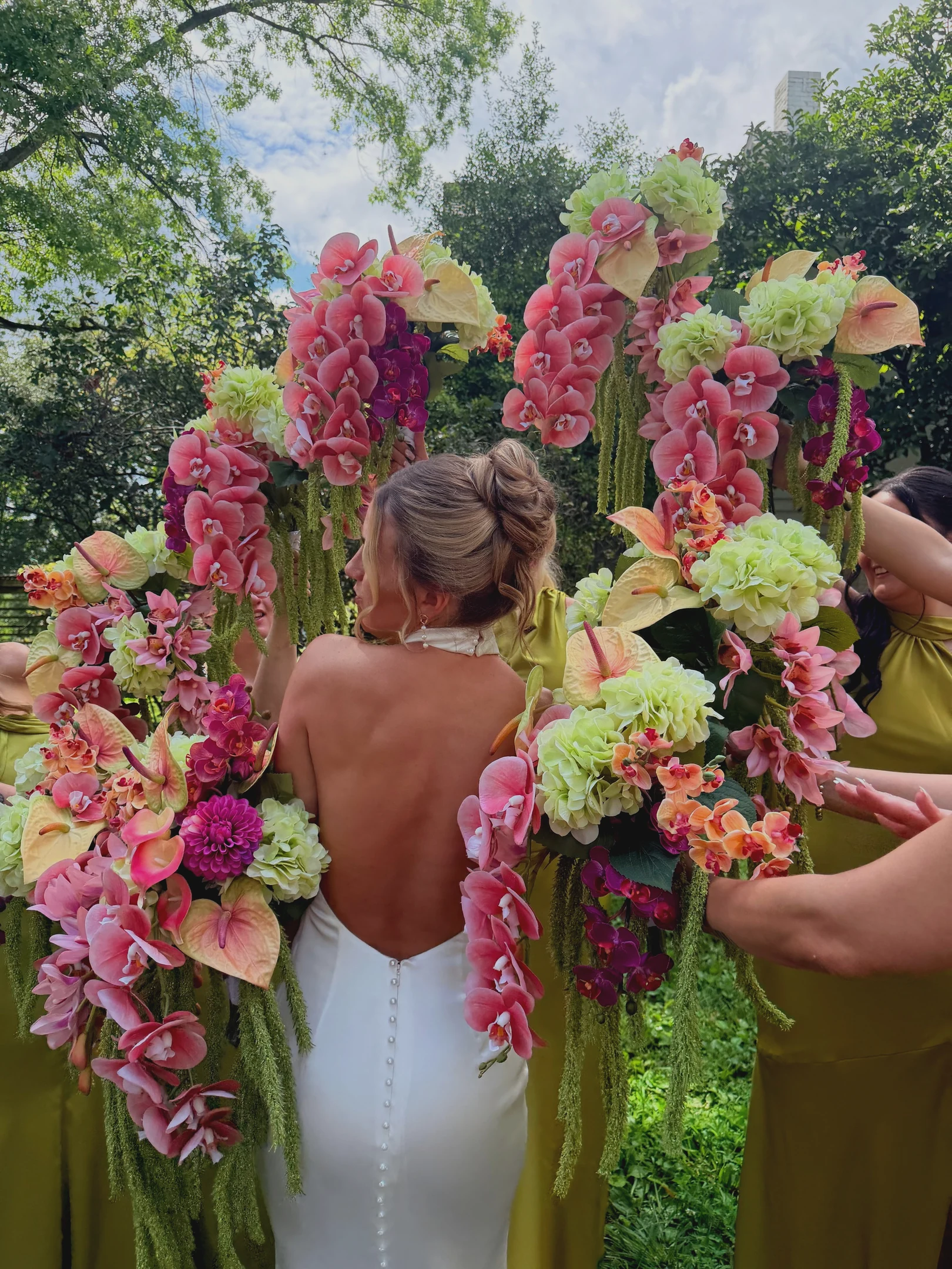 Kiwi surrounded by colorful floral arrangements