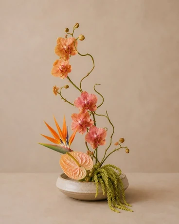 Sculptural orange ikebana arrangement